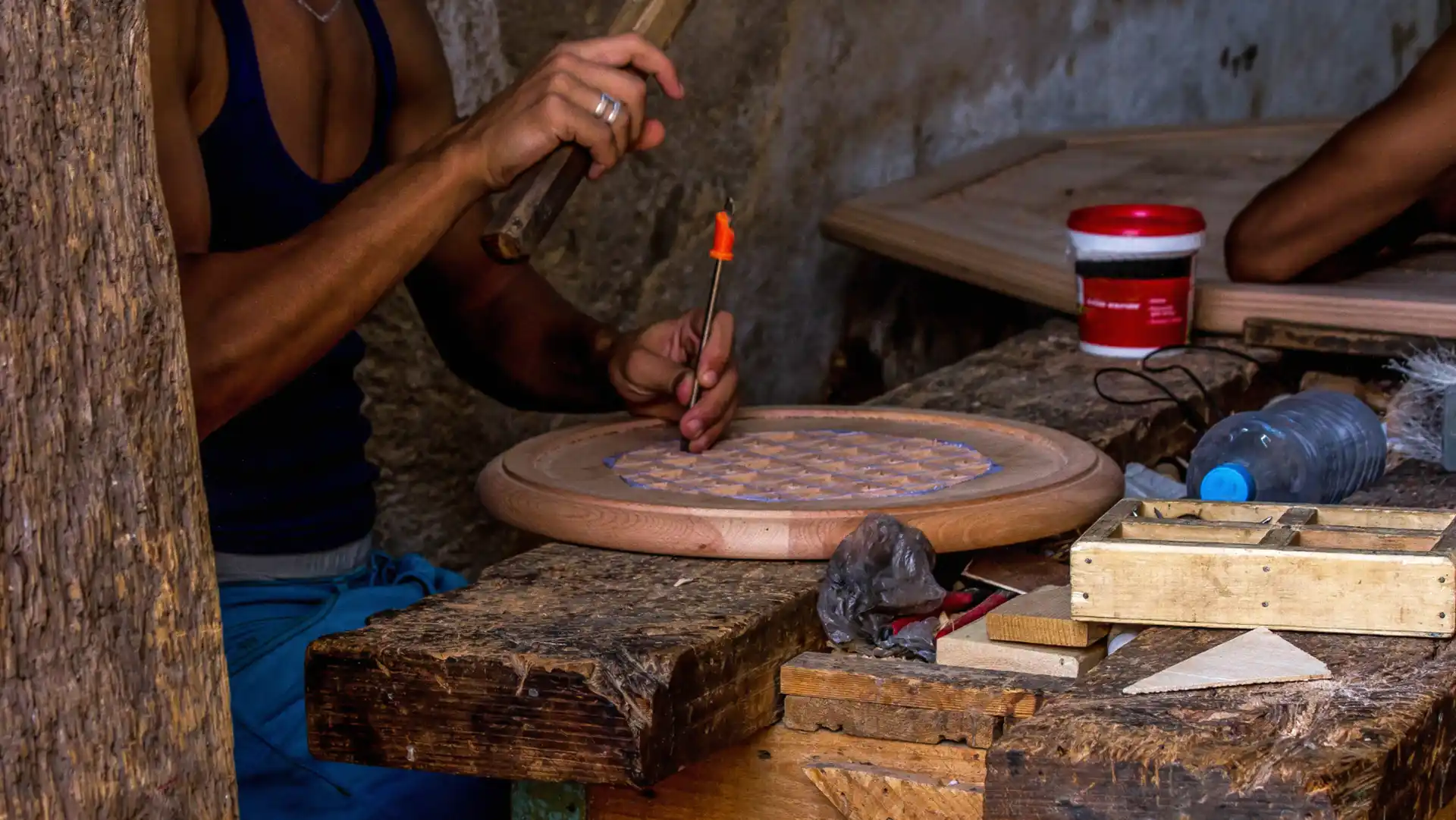 a Carpenter crafting traditional table in old medina Fez Morocco tours